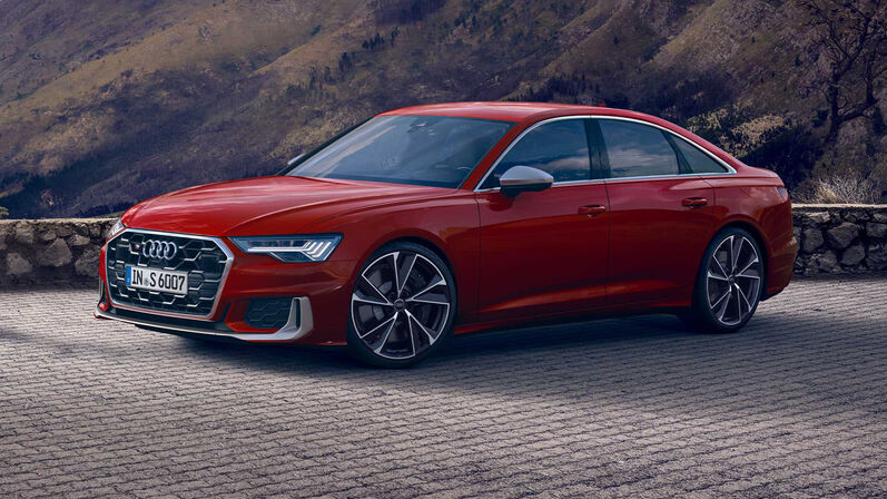 Audi S6 Limousine in Rot, parkt vor einer schönen Kulisse.